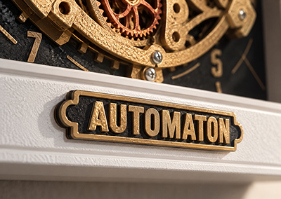 Рельефная надпись из полимера на декоративной плашке часов Automaton InFrame