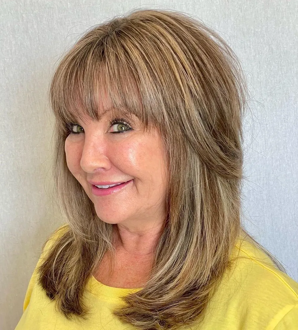 7-below-the-shoulders-layered-hairstyle-with-bangs 7-below-the-shoulders-layered-hairstyle-with-bangs.webp