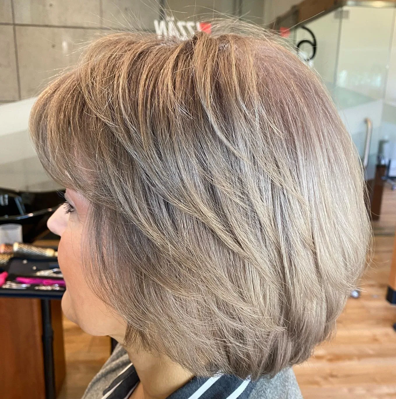 14-silver-bronze-layered-bob-with-bangs 14-silver-bronze-layered-bob-with-bangs.webp