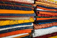 closeuo-colorful-textile-fabric-shop_53876-31319.webp