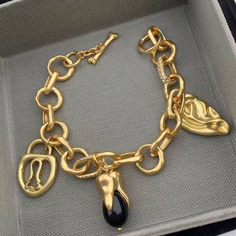 Браслет - цепь SCHIAPARELLI с подвесками из латуни в позолоте lux