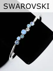 Жесткий браслет Эльза с голубыми камнями Swarovski