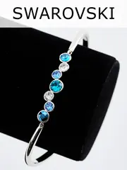 Жесткий браслет Эльза с синими камнями Swarovski