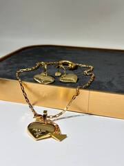 20257-Серьги PRADA c подвесками сердце латунь в позолоте