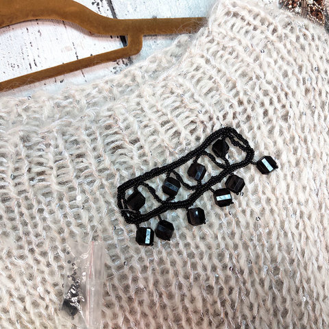 Декоративная вышивка из черного бисера сток Max Mara