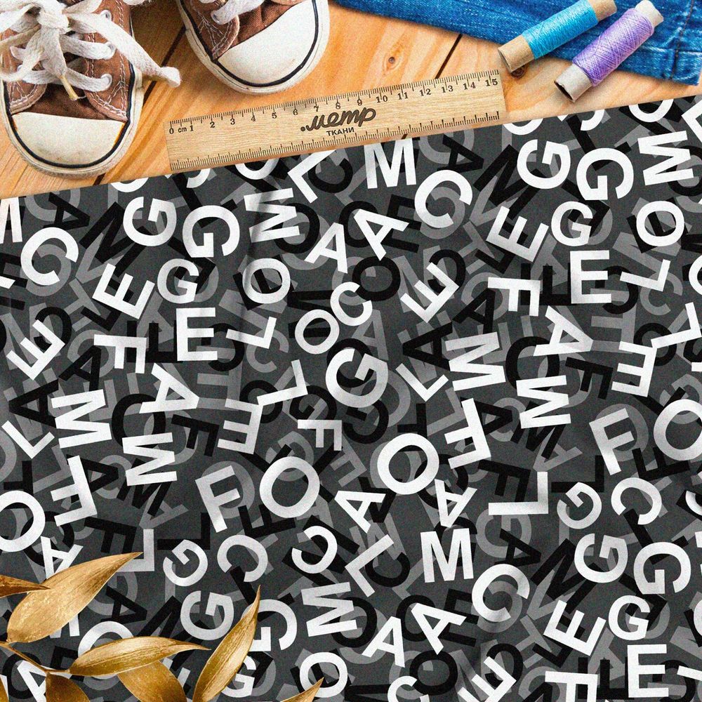 Ткань дюспо хаос их букв на чёрном фоне