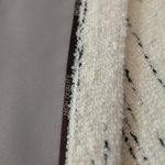 Шерстяная портьерная ткань «Ivory Pinstripe Bouclé» — плотное букле с вертикальной графитовой полосой для штор от пола до потолка