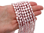 Нить гематитовых бусин с покрытием, галтовка 6-7мм (уценка)
