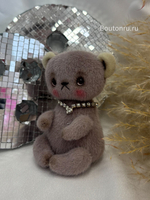 Игрушка в виде серого мишки ручная работа