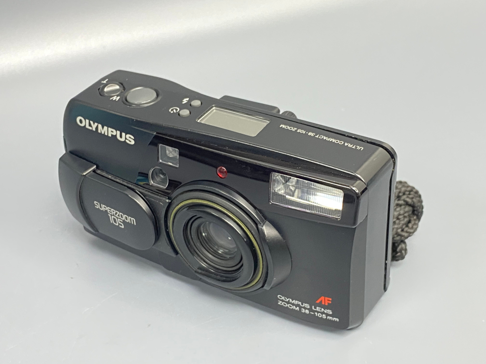 Olympus SuperZoom 105 мажет мимо пленки