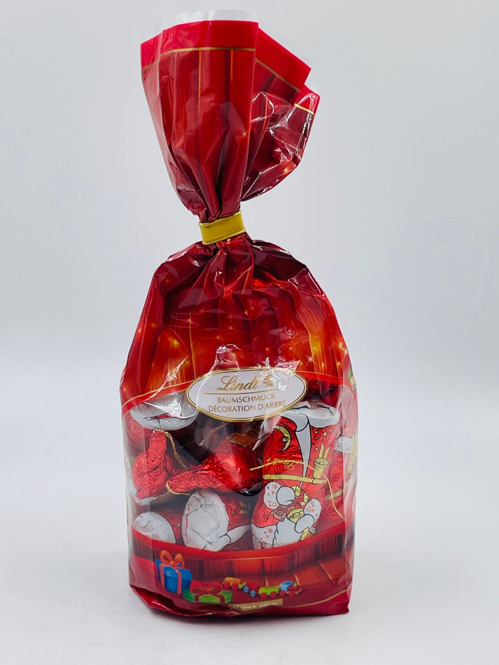Lindt Набор шоколадных ёлочных украшений мини Деды морозы, 120 г, в 1 уп. 12 фигурок (Германия)