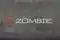 Кресло игровое Zombie Drift/F серый/черный крестов. пластик подст.для ног