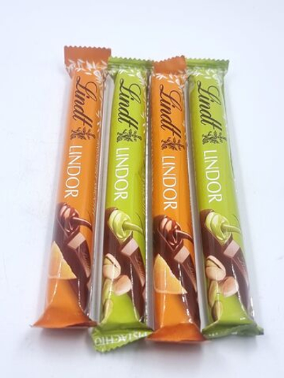 Lindt Lindor молочный шоколад с с фисташками и вкусом апельсина 4 шт по 38 г (Из Финляндии)