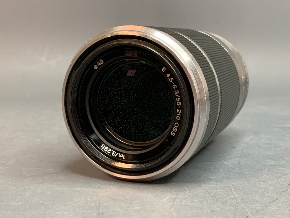 Sony 55-210mm f/4.5-6.3 E OSS внутри налет в виде точек