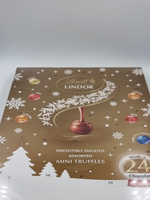 Адвент-календарь Lindt LINDOR ассорти из молочного, темного и белого шоколада с мягкой начинкой 117 г (Из Финляндии)
