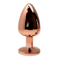 Золотистая анальная пробка 7см розовым кристаллом Cnex Wooomy Tralalo Rose Gold Metal Plug Small Magenta
