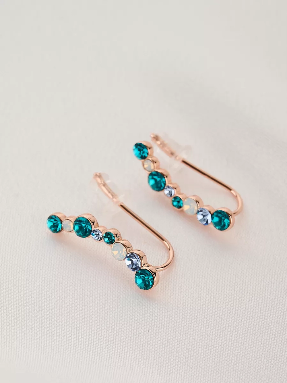 Серьги-клаймберы Млечный путь с зелеными кристаллами Swarovski