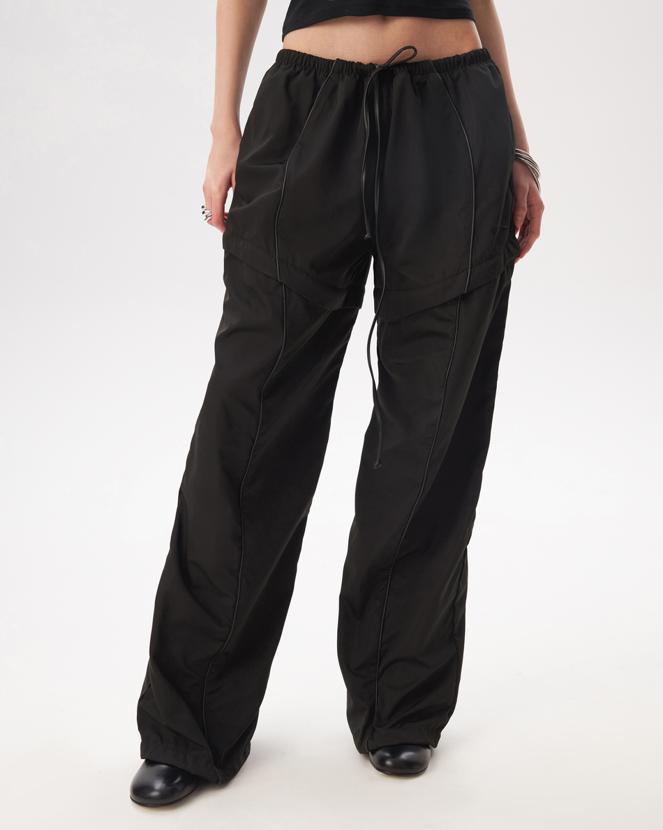 BLACK TRANSFORMING TRACKPANTS