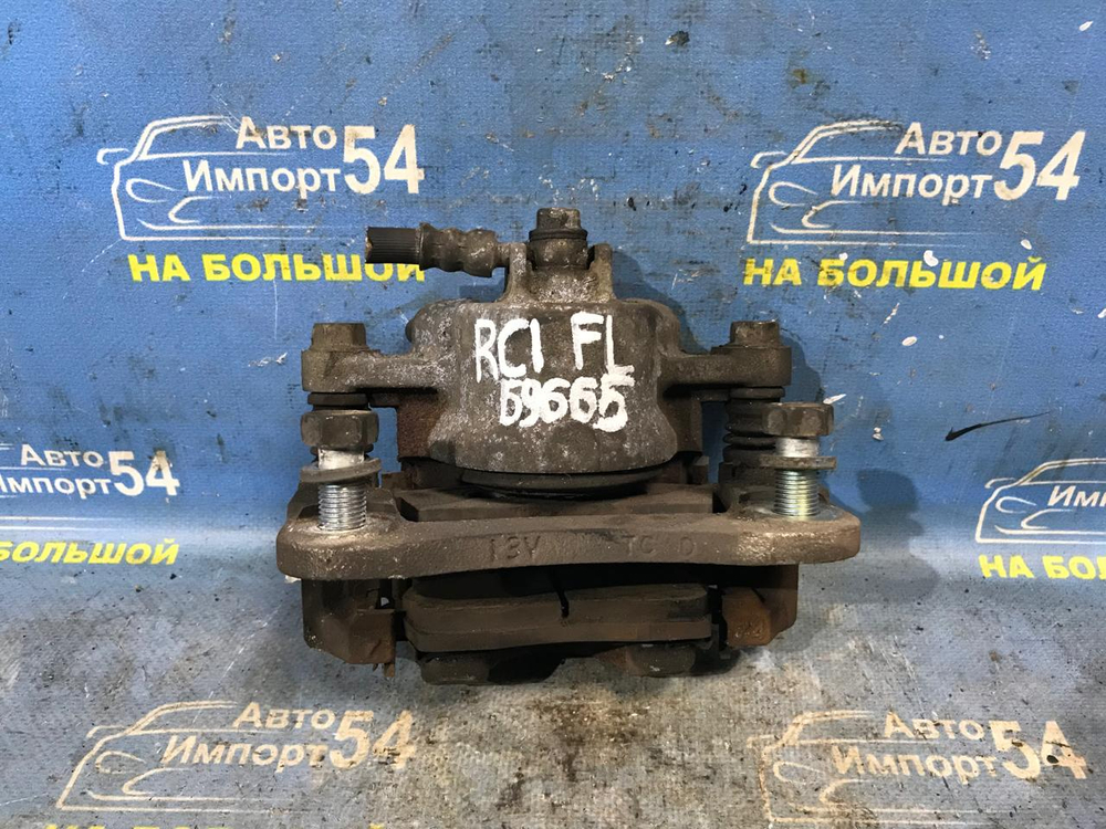 Суппорт тормозной передний левый SUBARU R2 2003-2010