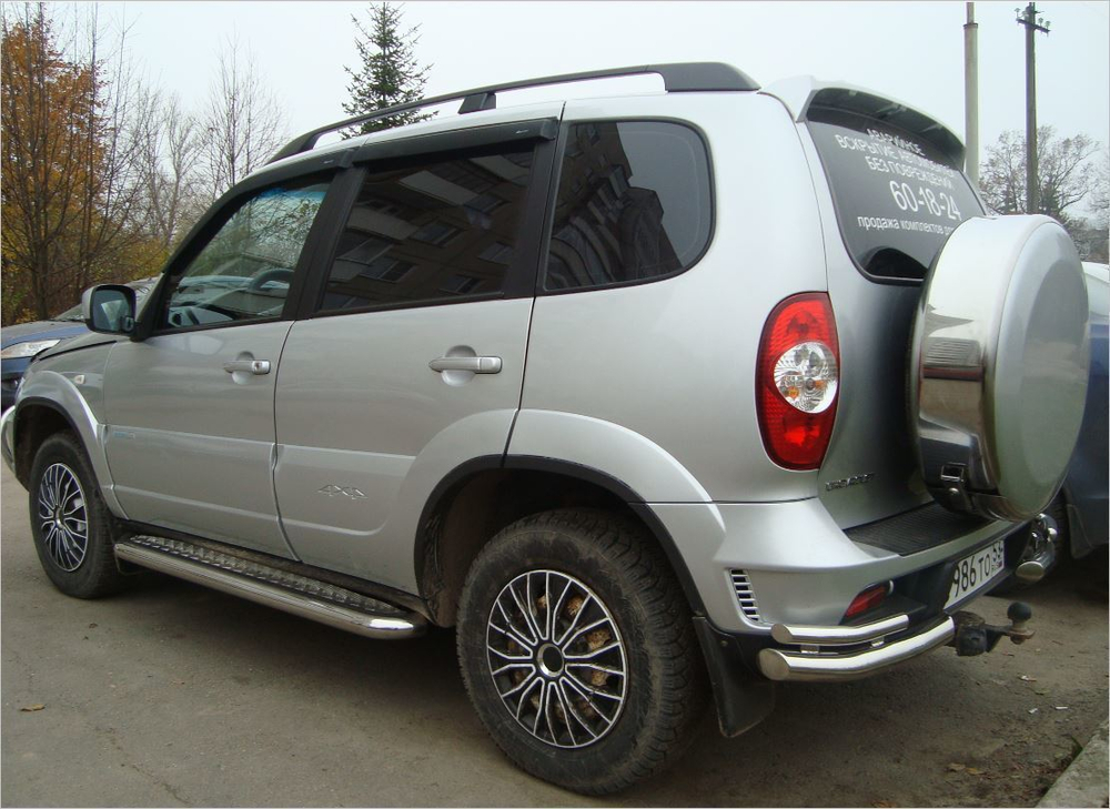 Пороги с алюминиевым листом (Ø=63,5 мм), Chevrolet Niva (03.2009 - )/Lada Niva (07.2020 -), Нива Тревел (нержавеющая сталь)