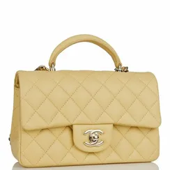 Стеганая мини-сумка Chanel с ручкой