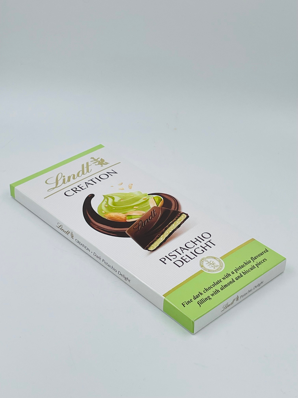 Шоколад LINDT Creation темный с начинкой Pistachio Delight Фисташковое наслаждение (фисташки, миндаль, печенье)150 г (из Финляндии)
