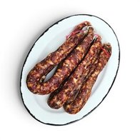Колбаса мясная "Лесная с клюквой"