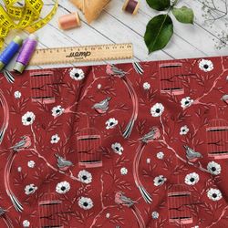 Ткань ниагара мелкие снегири, цветы и птичьи клетки на бордовом фоне