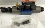 4WREE10W25-2X/G24K31/A1V - Пропорциональный распределитель с обратной связью по положению золотника со встроенным усилителем Ду10, A1 = ±10 В, номинальный расход 25 л/мин, схема W