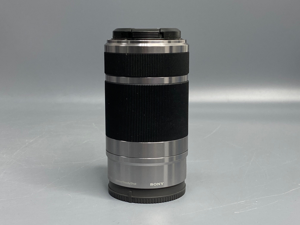 Sony 55-210mm f/4.5-6.3 E OSS микроточки внутри линзы