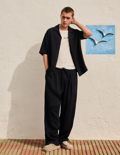 Мужские брюки baggy из рустикальной ткани - BERSHKA