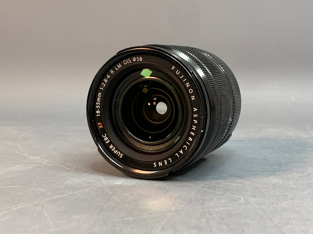 FujiFilm XF 18-55mm 2.8-4 R LM OIS, маленький точка на передней линзе