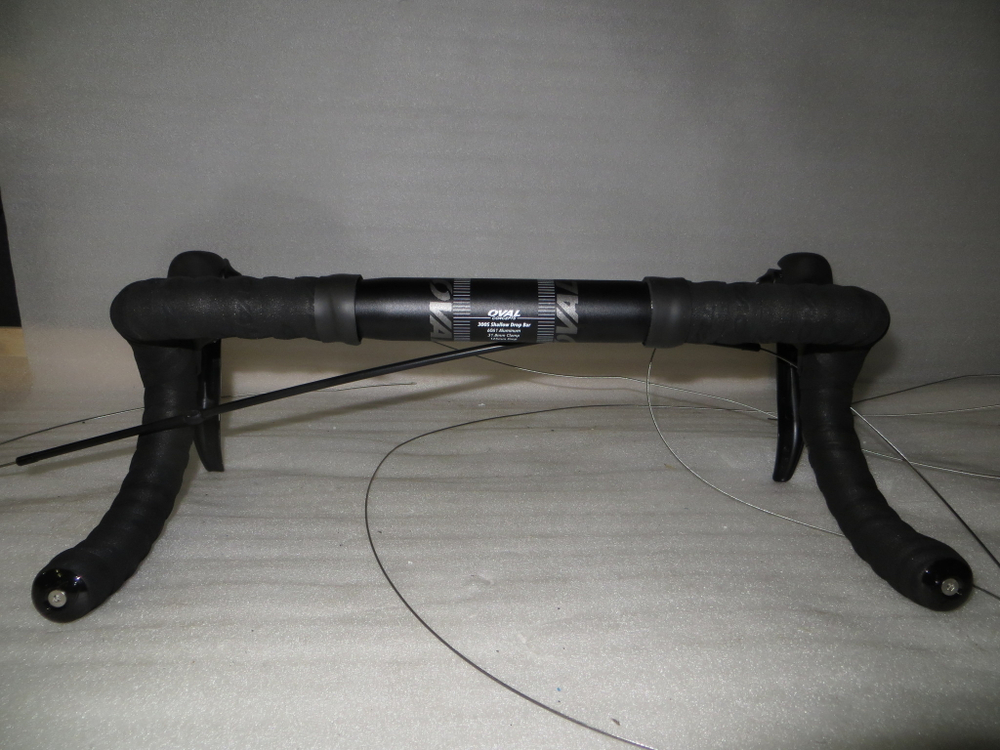 Handlebar: Oval Concepts 300S Shallow Drop, 6061 alloy, 31.8mm clamp, 133mm compact drop