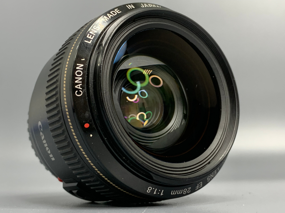 Canon EF 28mm 1.8 USM царапина на линзе