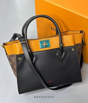 Сумка-тоут чёрная с охристыми и коричневыми вставками от Louis Vuitton Milla MM BP5-878294