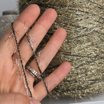 DECORATION - Millefili S.р.A.; 34% люрекс, 66% п/а; 380м/100гр; золотая травка на черном эластичном шнурке. MP
