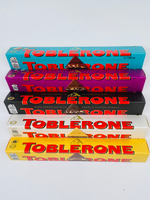 Toblerone ассорти из 5 видов темный+белый+молочный шоколад, мед, нуга, соленая карамель, изюм (6х100 г) 600 г (Швейцария)