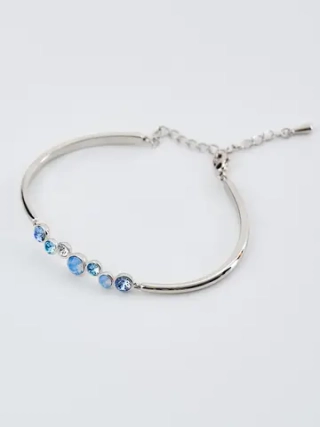 Жесткий браслет Эльза с голубыми камнями Swarovski