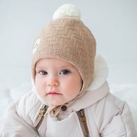 Шапка зимняя на завязках с помпоном "Беж меланж" 0+
