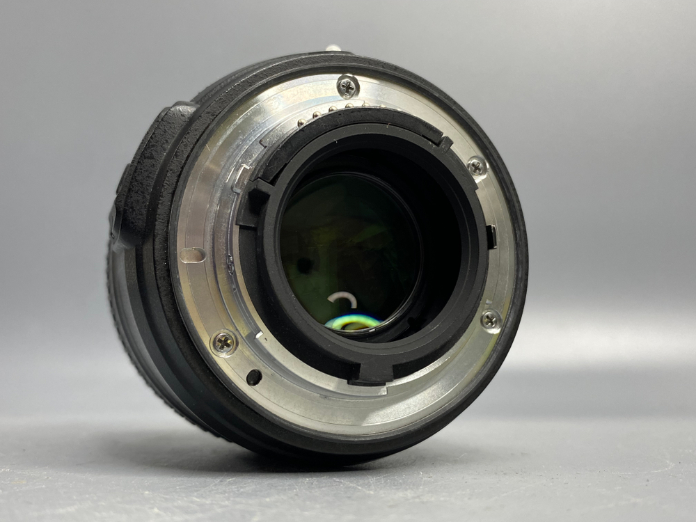 Nikon 50mm 1.8G пылинки
