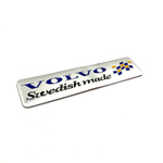 Наклейка Volvo Swedish made объемная полиурентан (шильдик Вольво Сделано в Швеции, 12х2,5см). Серебро с синим/черным и желтым флагом