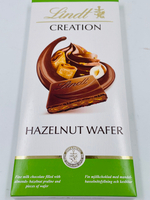Шоколад молочный Lindt CREATION миндально-ореховое пралине с кусочками вафли,150 г