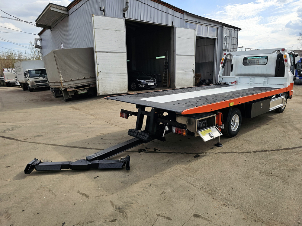 Купить новый ISUZU ELF 4.5 т. эвакуатор со сдвижной платформой
