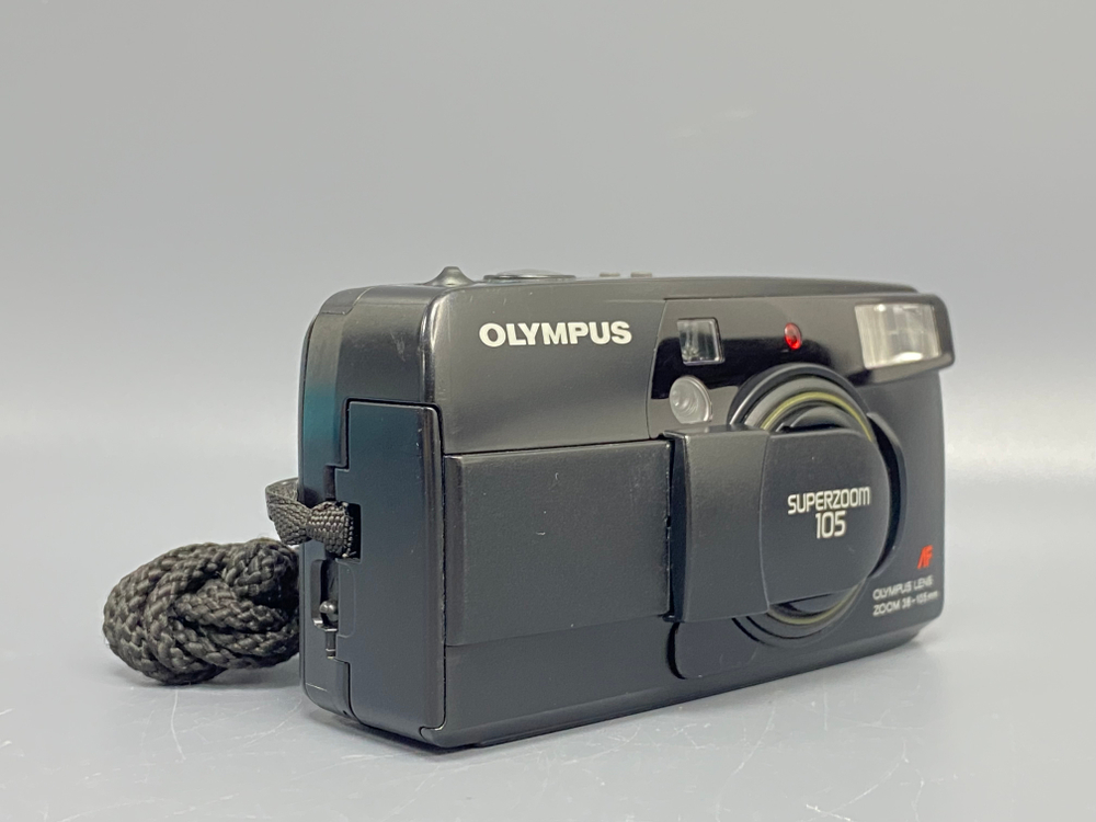 Olympus SuperZoom 105 мажет мимо пленки