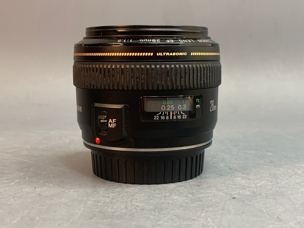 Canon EF 28mm 1.8 USM царапка на передней линзе