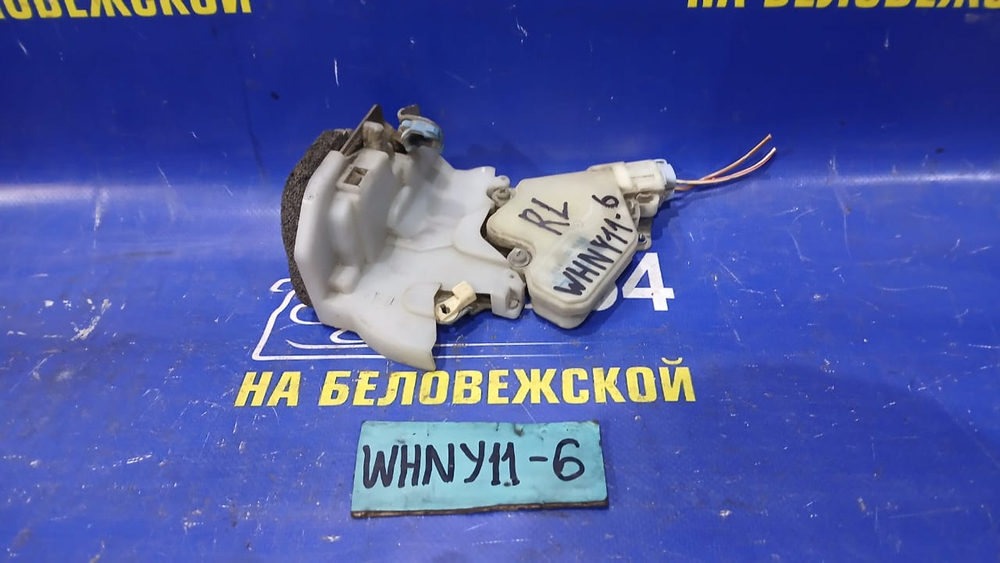Замок двери задней левой NISSAN WINGROAD 1999