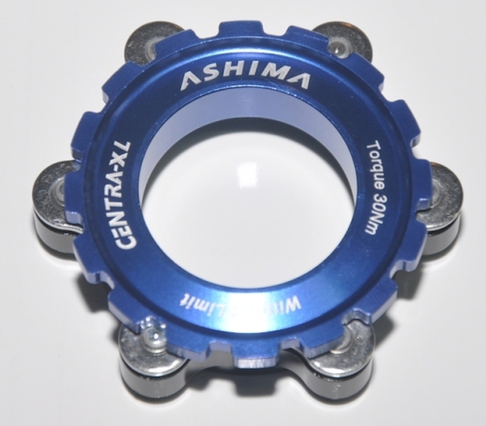 Адаптер синий, крепит 6-болт ротор на втулку Center Lock Shimano. В тч под оси ш15 и 20мм. AC03-BU