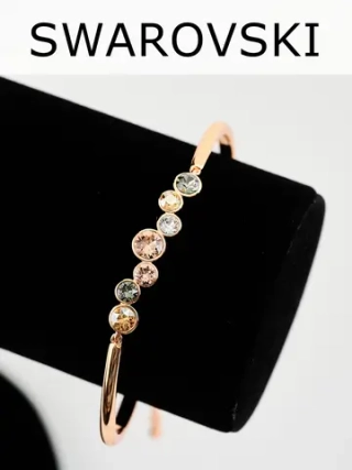 Жесткий браслет Эльза с камнями Swarovski шампань