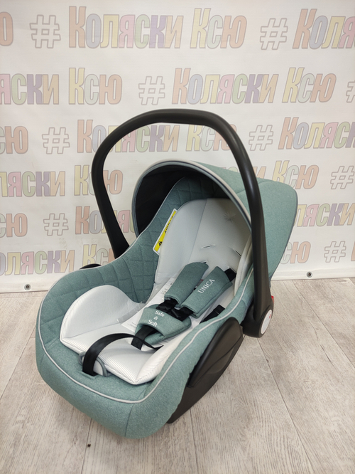 Автолюлька Indigo Unica группа 0+ (0-13кг) зеленый
