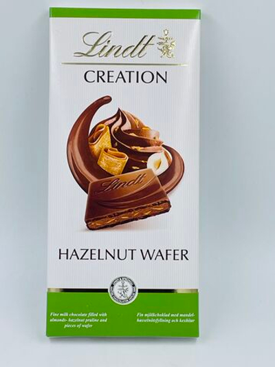 Шоколад молочный Lindt CREATION миндально-ореховое пралине с кусочками вафли,150 г